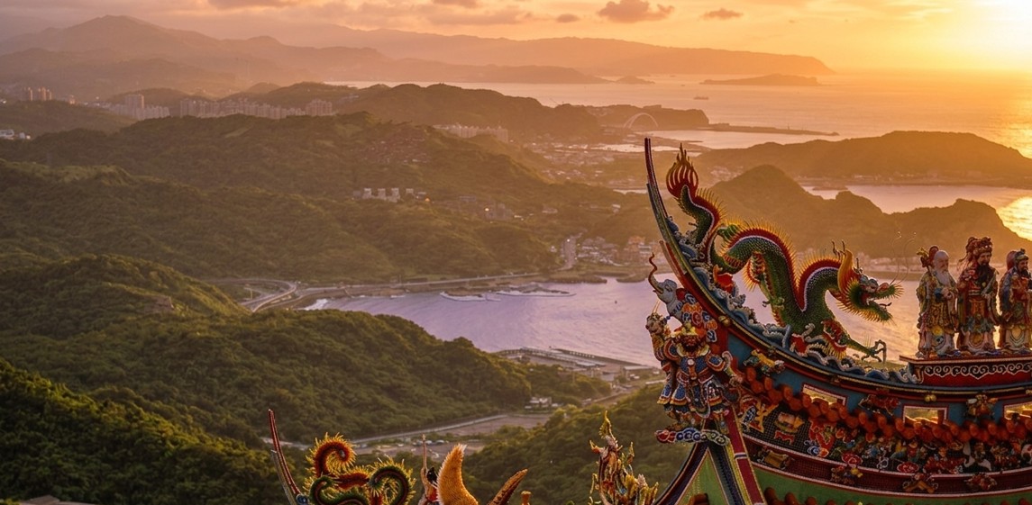 Sunset over the mountains and bay near Jiufen, seen from a temple rooftop
